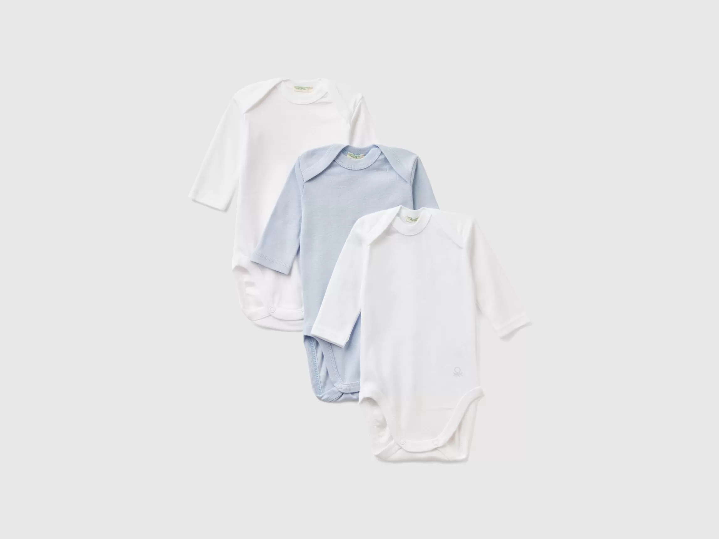 United Colors of Benetton Three solid color bodysuits in organic cotton
