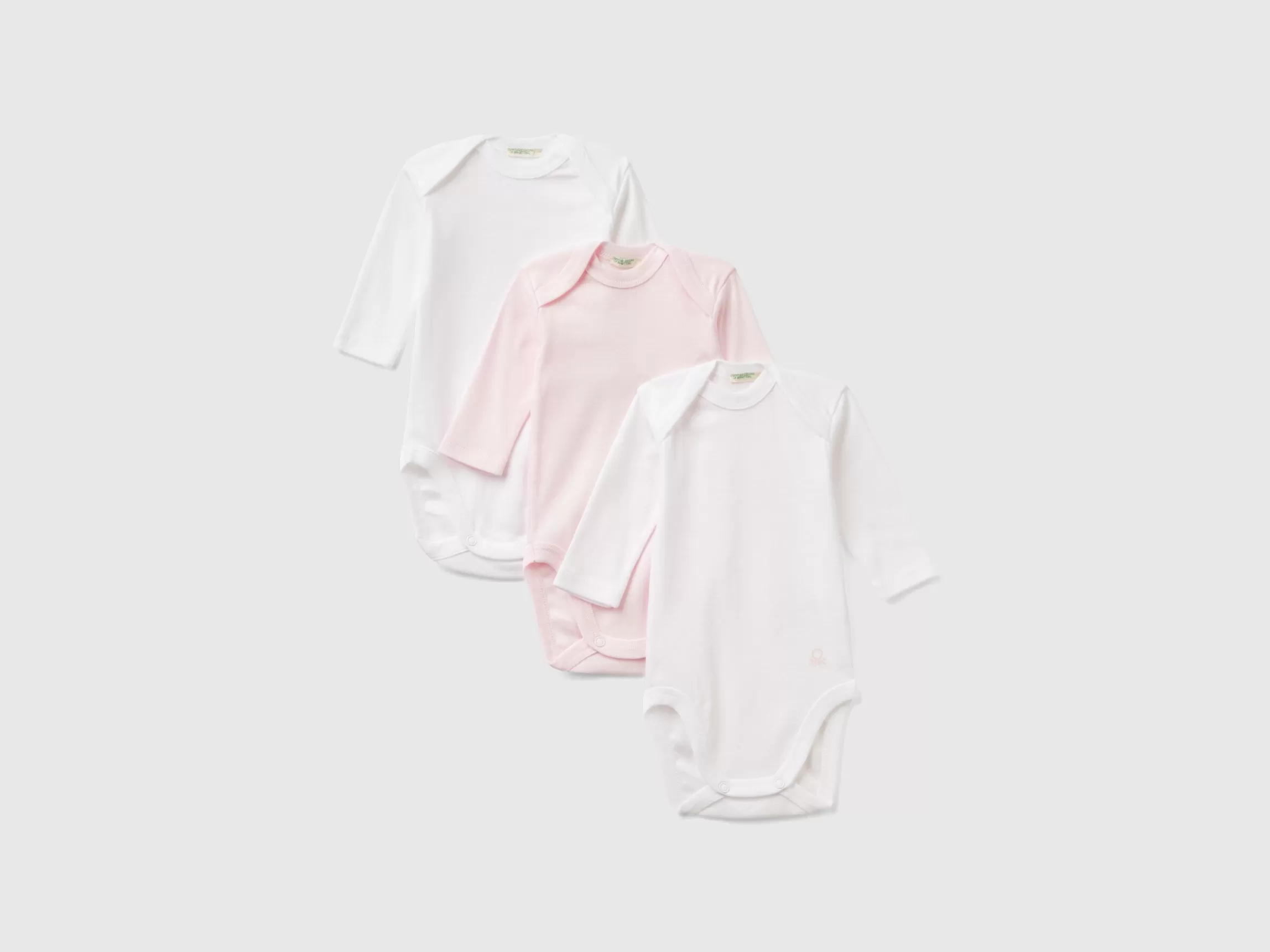 United Colors of Benetton Three solid color bodysuits in organic cotton