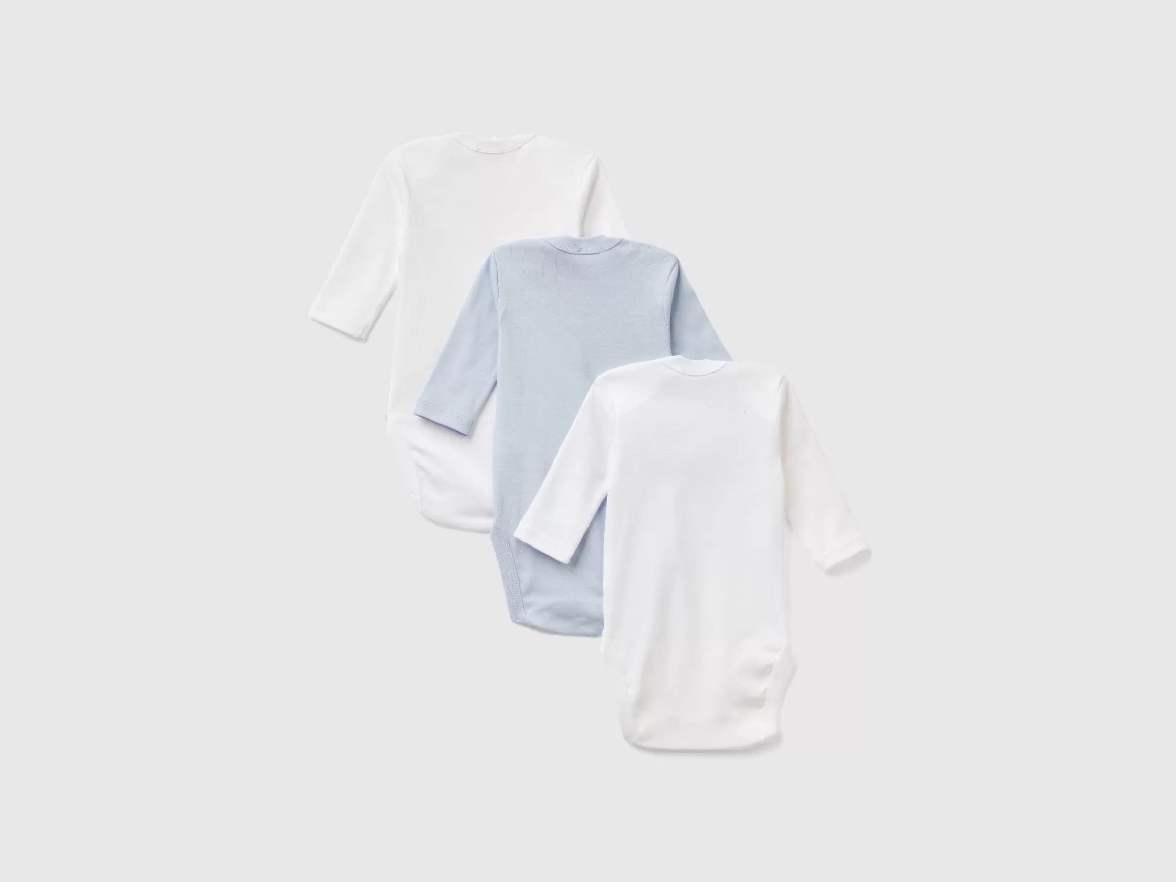 United Colors of Benetton Three solid color bodysuits in organic cotton