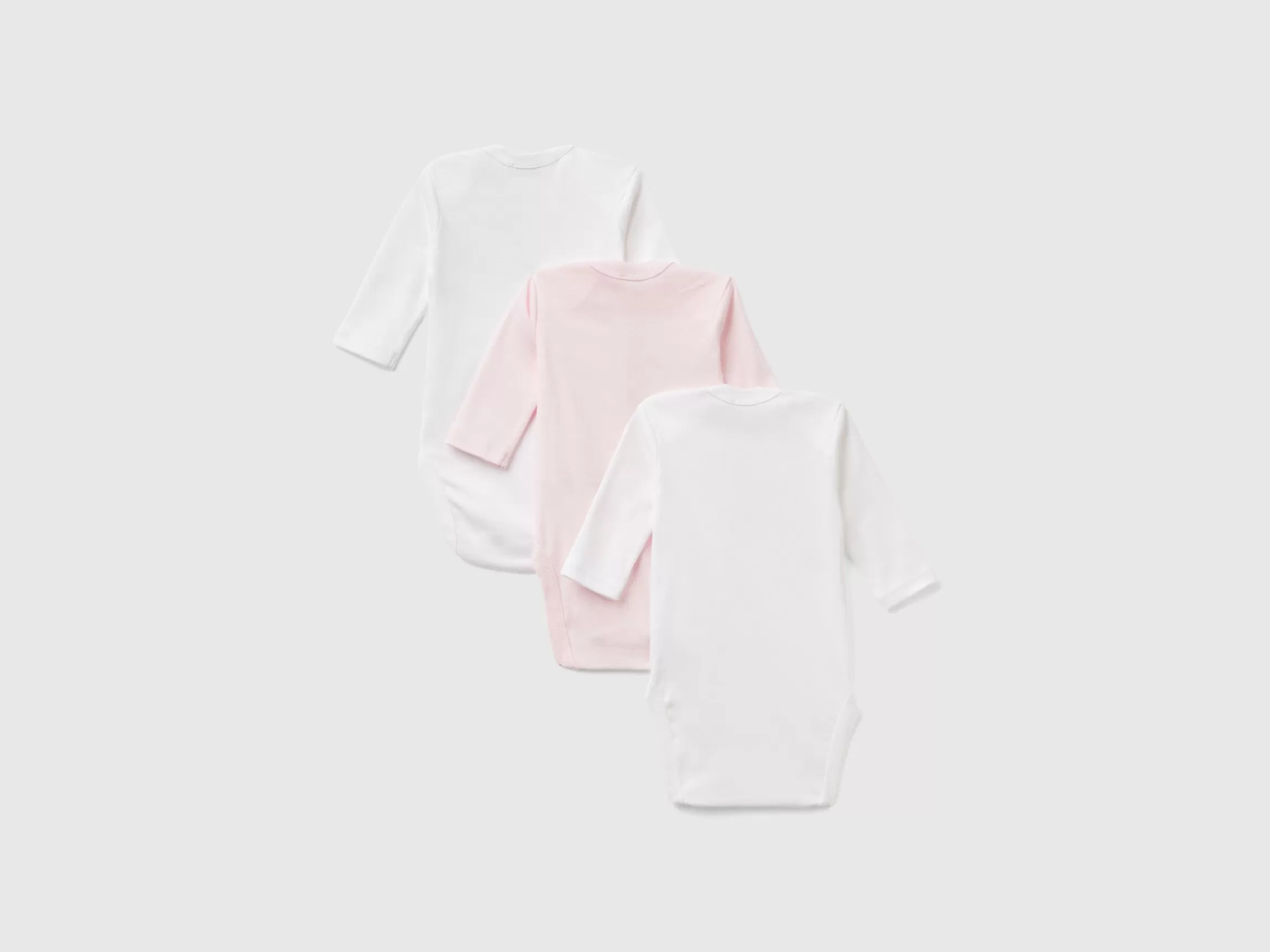 United Colors of Benetton Three solid color bodysuits in organic cotton